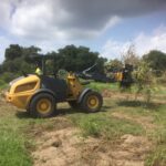 Land excavation and grading with John Deere 304L