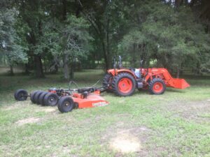 Tractor and loader services Bush hogging brush clearing