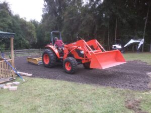 M6060 tractor with finishing box blade for driveways or RV pads