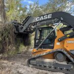 Land excavator clearing overgrown land in Florida
